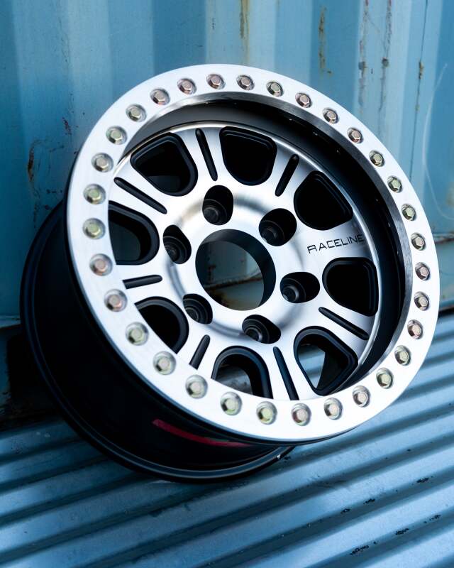Raceline RT232 Monster 17x8.5in/5x139.7 BP/-25mm Offset/107.95mm Bore - Black & MACH. Beadlock Wheel