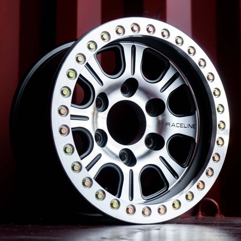 Raceline RT232 Monster 17x8.5in/5x139.7 BP/-25mm Offset/107.95mm Bore - Black & MACH. Beadlock Wheel